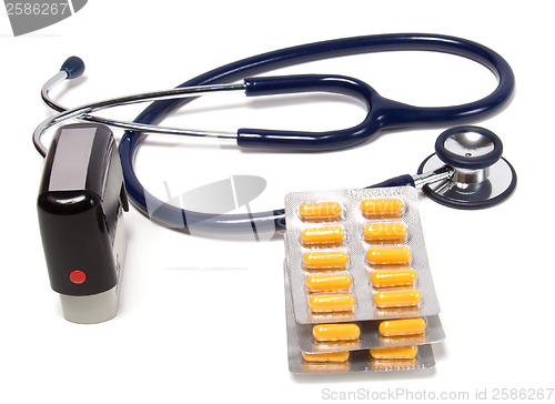 Image of stethoscope, tablets  and doctor seal isolated on white backgrou