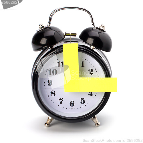 Image of Alarm clock with sticky paper 