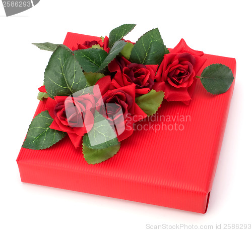 Image of Gift with floral decor. Flowers are artificial. 