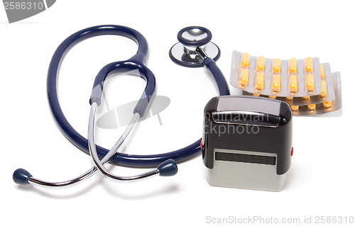 Image of stethoscope, tablets  and doctor seal isolated on white backgrou