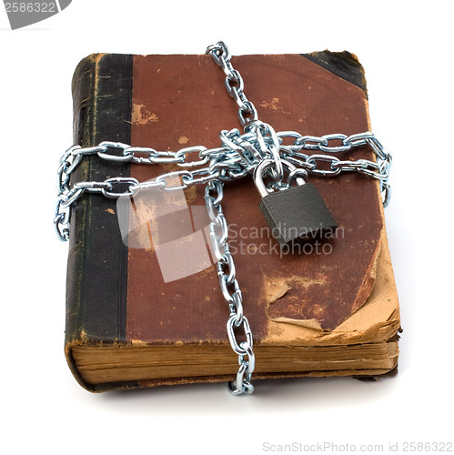 Image of tattered book with chain and padlock isolated on white backgroun