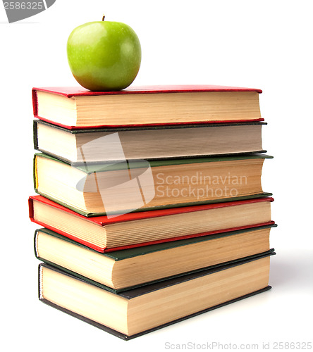 Image of book stack with apple isolated on white background 