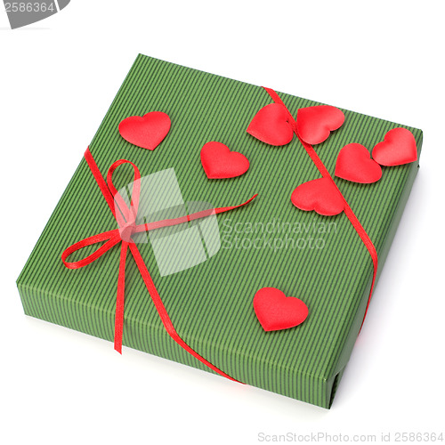 Image of gift with heart decoration isolated on white