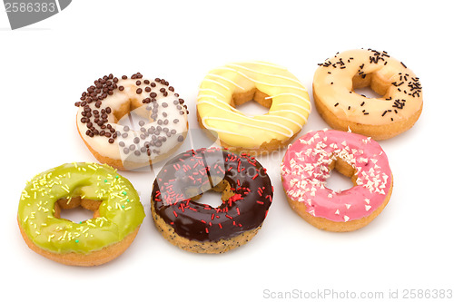 Image of Delicious doughnuts isolated on white background 