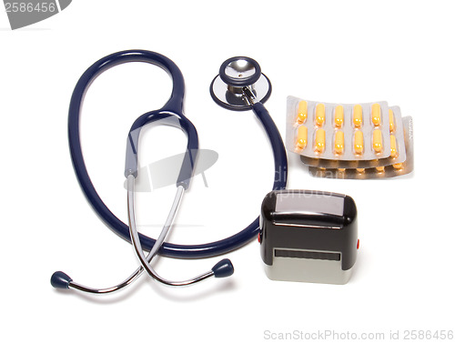 Image of stethoscope, tablets  and doctor seal isolated on white backgrou