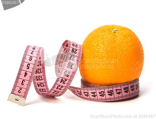 Image of  tape measure wrapped around the orange isolated on white backgr