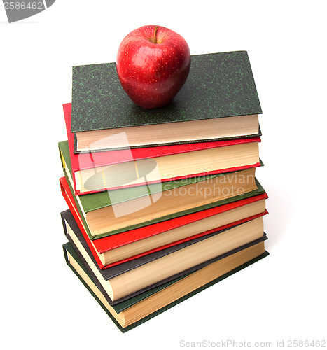 Image of book stack with apple isolated on white background 