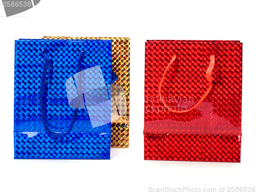 Image of shiny paper gift bags isolated on white background 