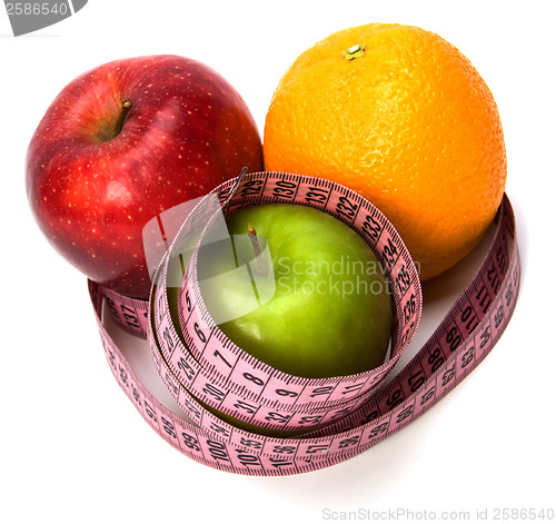 Image of  tape measure wrapped around fruits isolated on white background