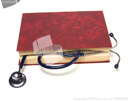 Image of stethoscope on red book isolated on white background