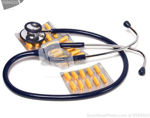 Image of stethoscope and tablets isolated on white background