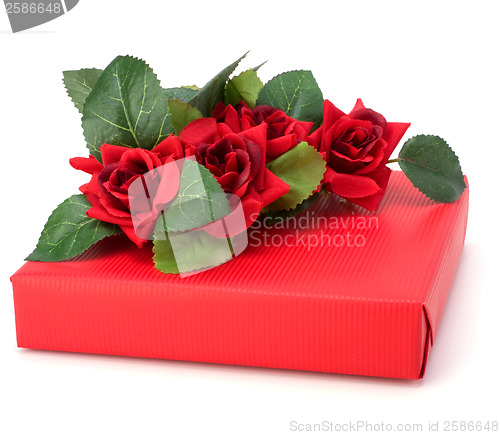 Image of Gift with floral decor. Flowers are artificial. 