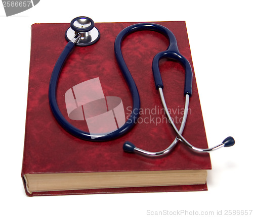 Image of stethoscope on red book isolated on white background