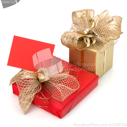 Image of 
Luxurious gifts with note isolated on white background 
