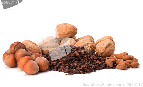 Image of grated chocolate and nuts isolated on white background