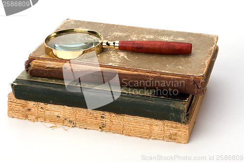 Image of tattered book stack over white background