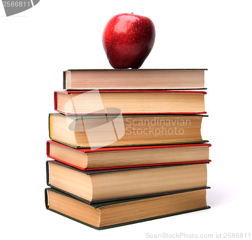 Image of book stack with apple isolated on white background 