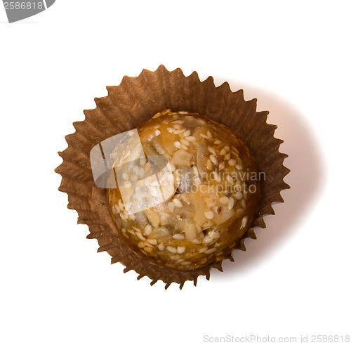 Image of Caramel sweets with sunflower seeds isolated on white 