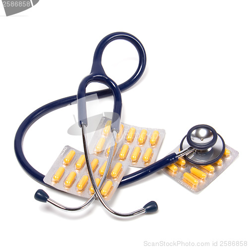 Image of stethoscope and tablets isolated on white background