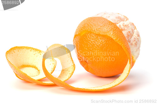 Image of orange with peeled spiral skin isolated on white background