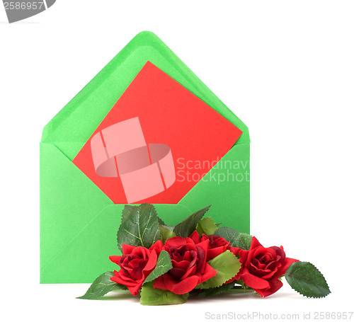 Image of Envelope with floral decor. Flowers are artificial. 