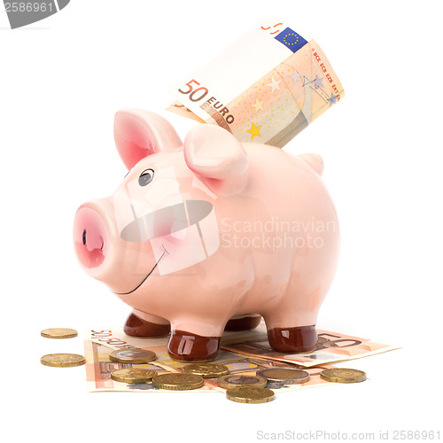 Image of Business concept. Lucky piggy bank isolated on white background.