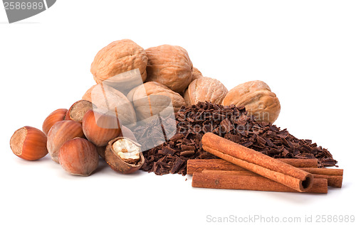 Image of grated chocolate and nuts isolated on white background
