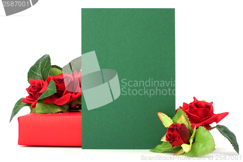 Image of Gift with floral decor. Flowers are artificial. 