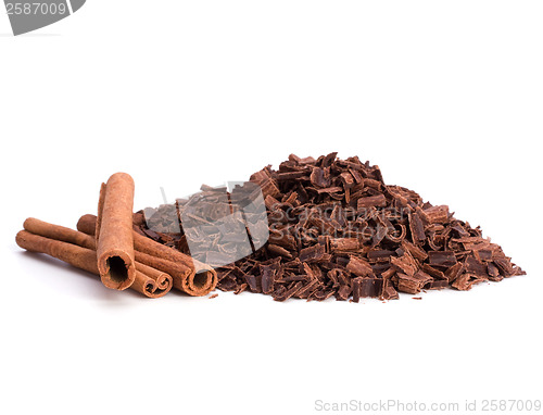 Image of grated chocolate and cinnamon isolated on white background