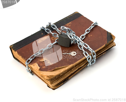 Image of tattered book with chain and padlock isolated on white backgroun