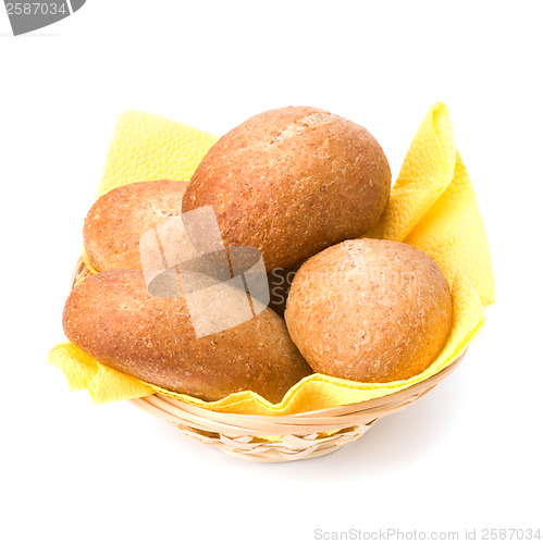 Image of fresh warm rolls in breadbasket isolated on white background