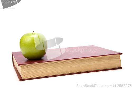 Image of book with apple isolated on white background 