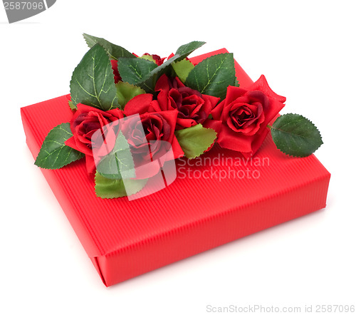 Image of Gift with floral decor. Flowers are artificial. 