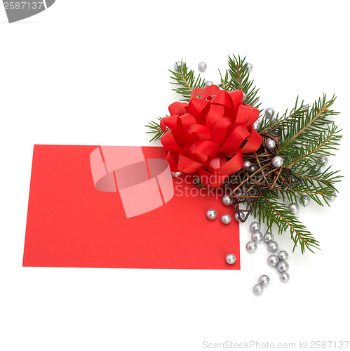 Image of Christmas decoration with greeting card isolated on white backgr