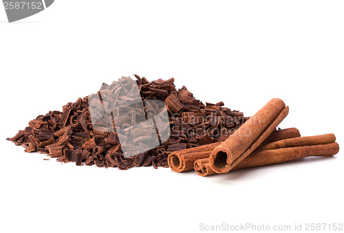 Image of grated chocolate and cinnamon isolated on white background