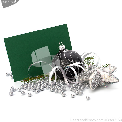 Image of Christmas decoration with greeting card isolated on white backgr