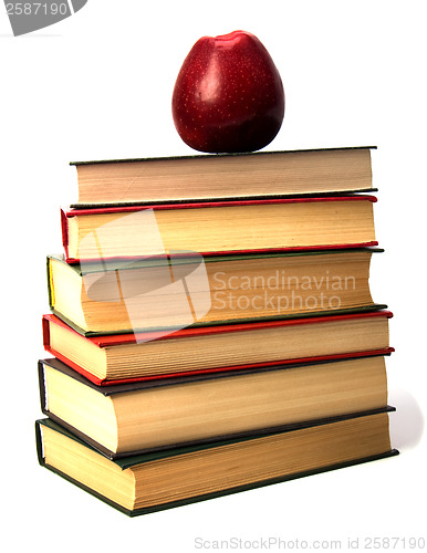 Image of book stack with apple isolated on white background 