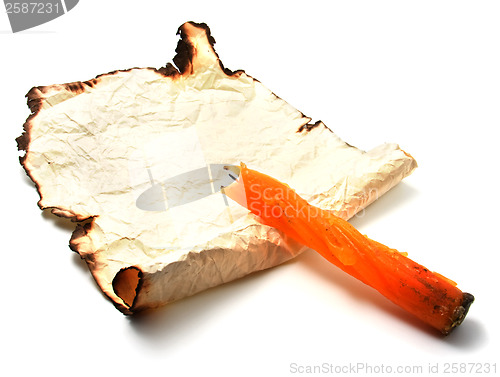 Image of Burnt paper with candle 