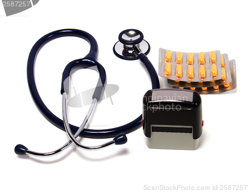 Image of stethoscope, tablets  and doctor seal isolated on white backgrou