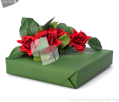 Image of Gift with floral decor. Flowers are artificial. 