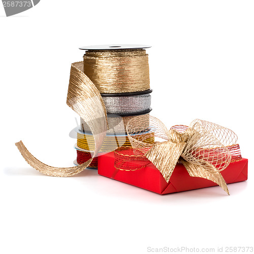 Image of Festive gift box and wrapping ribbons isolated on white backgrou