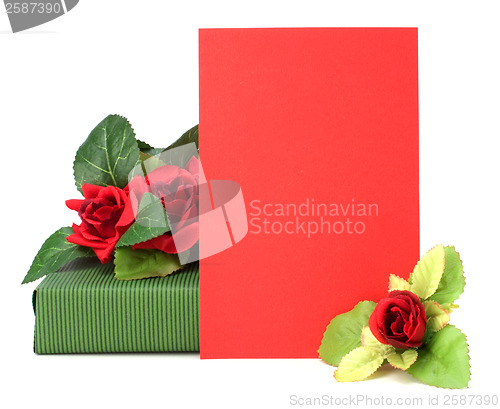 Image of Gift with floral decor. Flowers are artificial. 