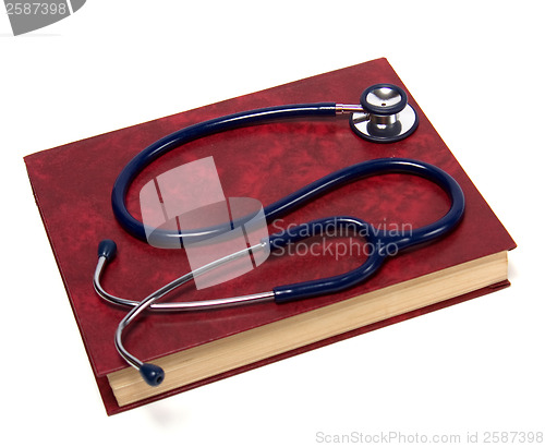Image of stethoscope on red book isolated on white background