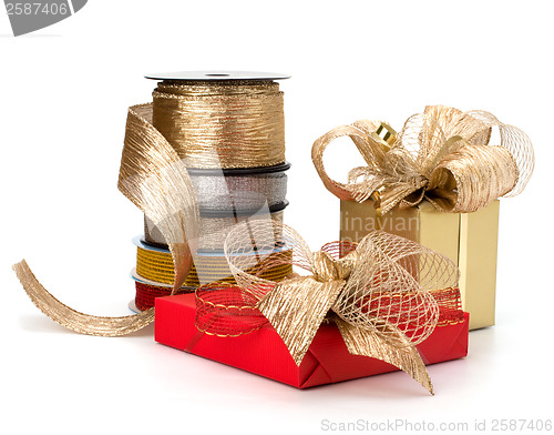 Image of Festive gift box and wrapping ribbons isolated on white backgrou