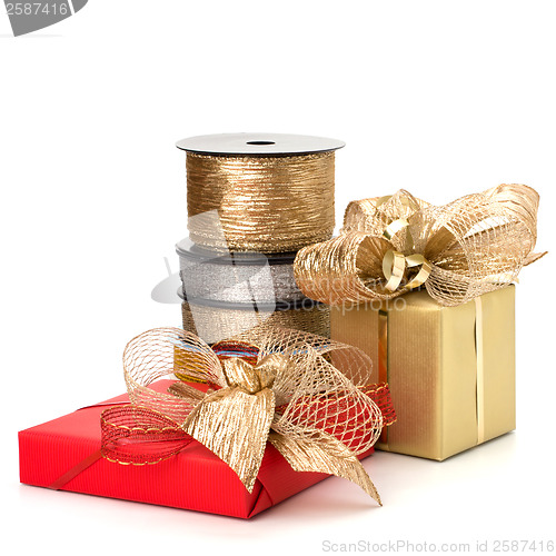 Image of Festive gift box and wrapping ribbons isolated on white backgrou