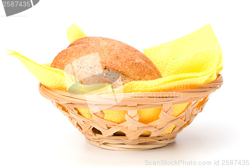 Image of fresh warm rolls in breadbasket isolated on white background