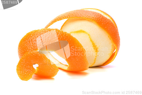 Image of orange with peeled spiral skin isolated on white background