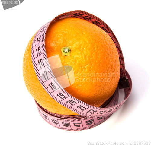 Image of  tape measure wrapped around the orange isolated on white backgr