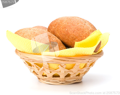 Image of fresh warm rolls in breadbasket isolated on white background