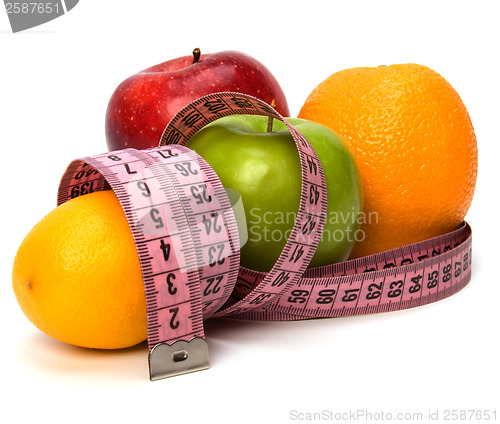 Image of  tape measure wrapped around fruits isolated on white background